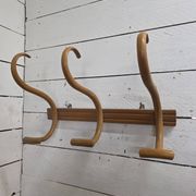 Curved wooden coat rack with 3 hooks, 1920s.