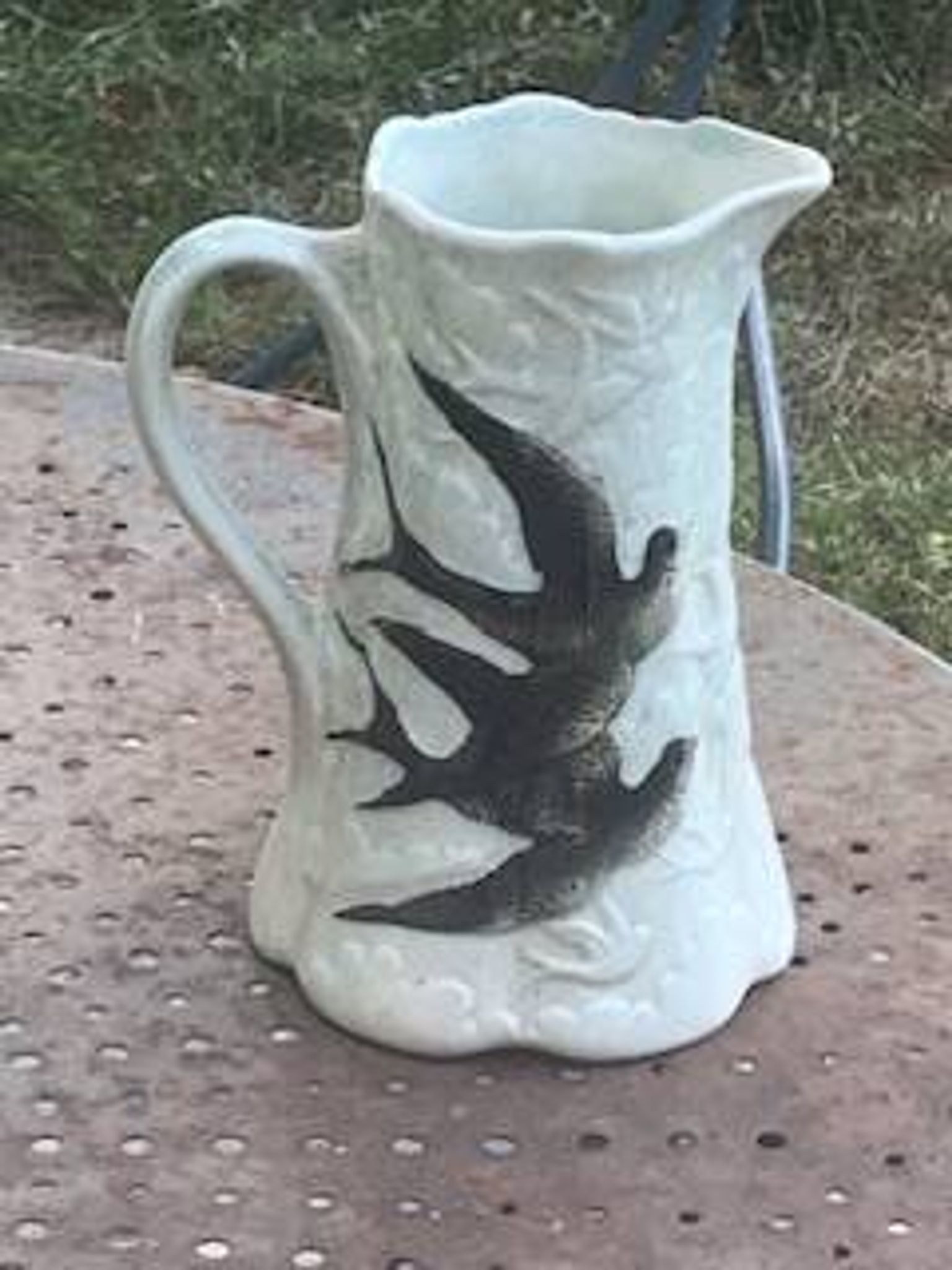 Jade green ceramic barbotine vase with swallows.