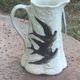 Jade green ceramic barbotine vase with swallows.