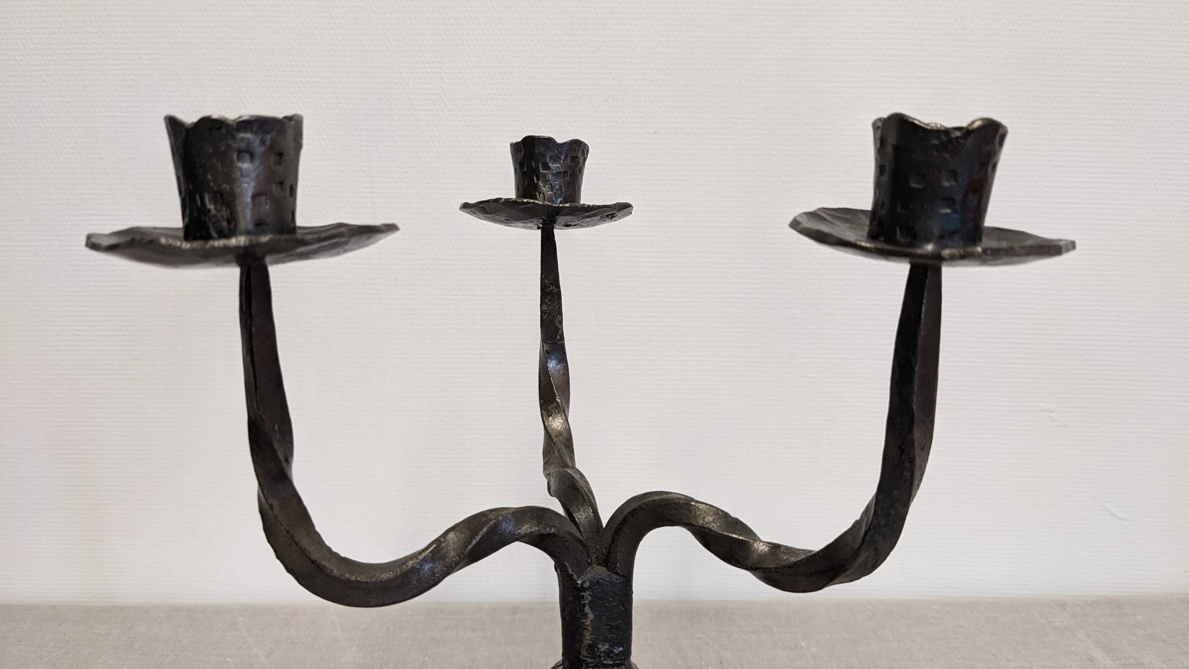 Brutalist candelabrum with 3 lights in wrought iron, France circa 1950.