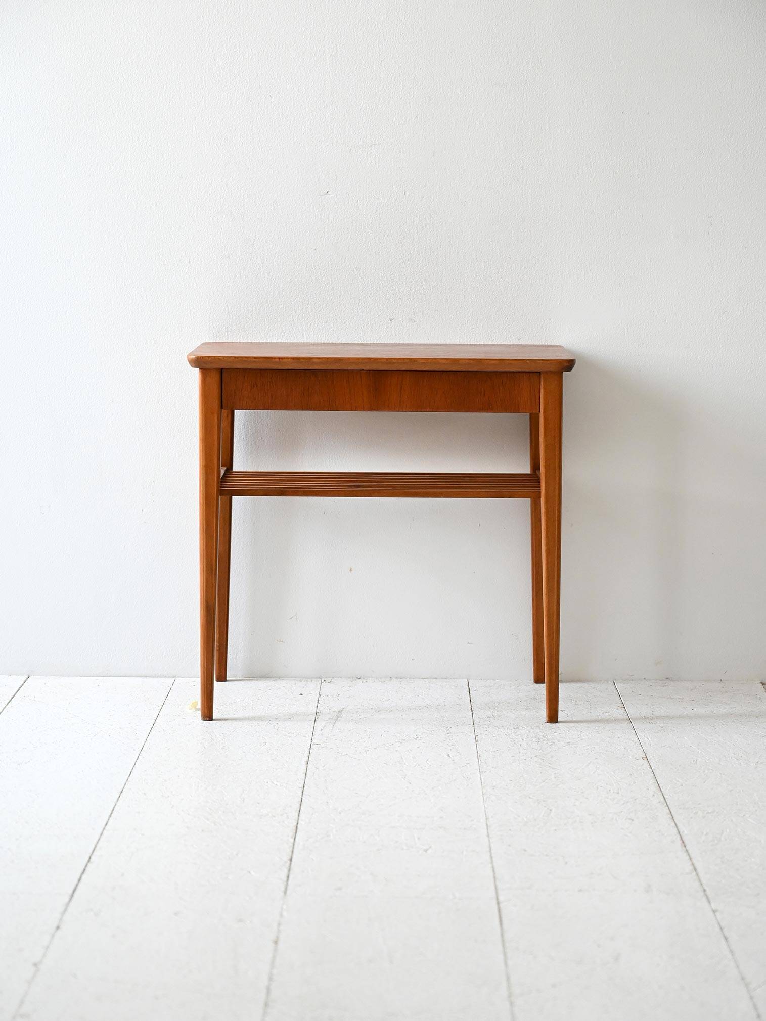 Scandinavian vintage teak nightstand with slatted shelf