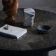 Round brutalist coffee table in stone and steel, mid-century French modernism, 1970s.