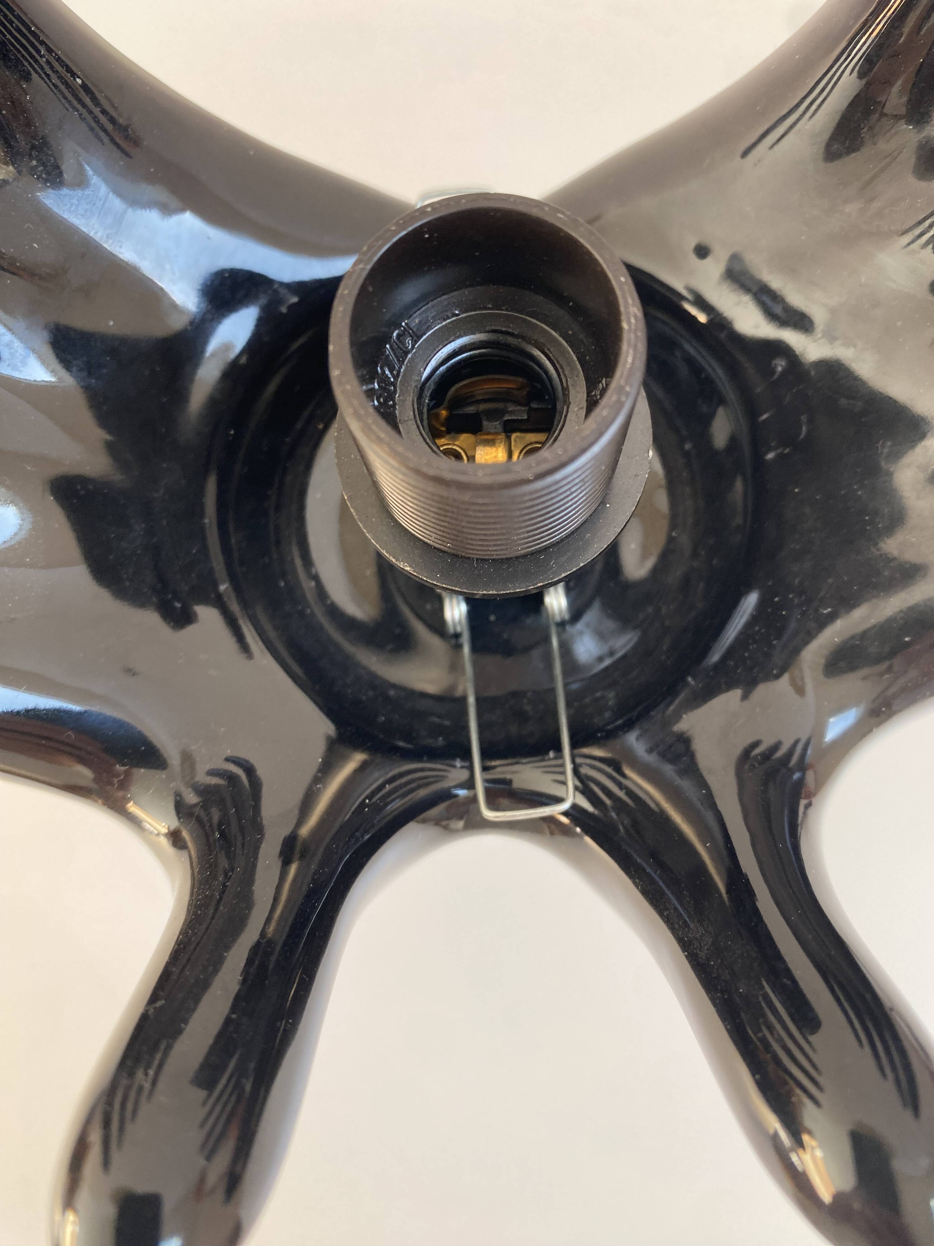 Sculpted ceramic globe lamp.