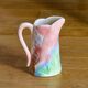 Vintage carafe in colorful fish slip