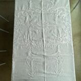 White hand-embroidered square tablecloth at stem stitch