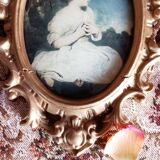 Medallion frame representing a little girl