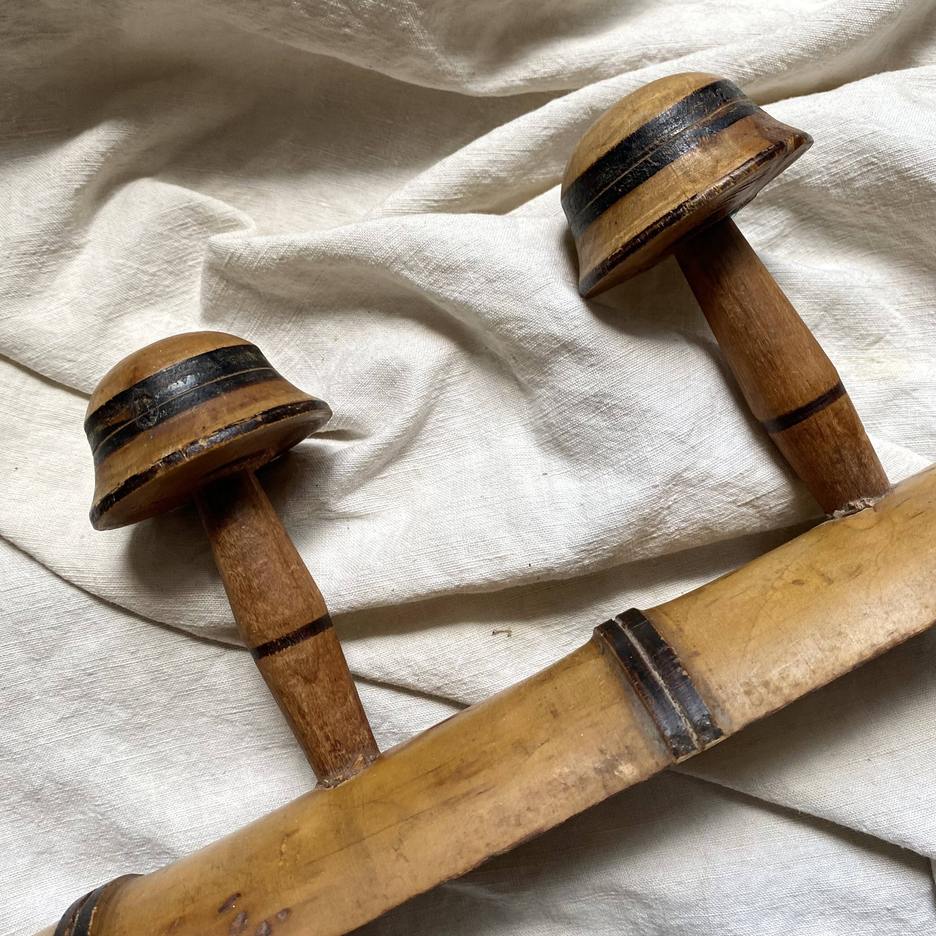 Antique wall-mounted coat rack in turned bamboo-style wood