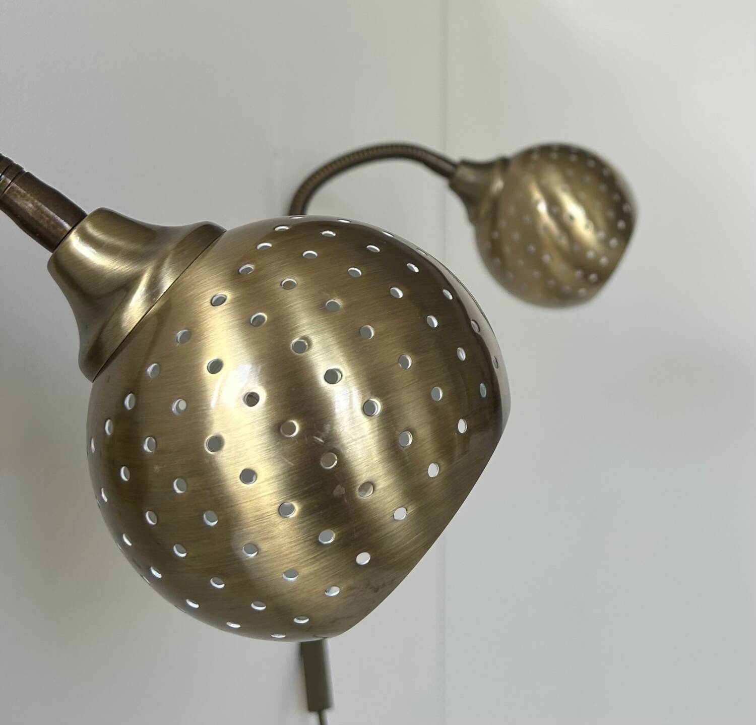 Pair of vintage adjustable wall lights, perforated brass, Sweden 1960