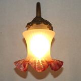 French Art Nouveau wall sconce in bronze with a white and pink glass shade.