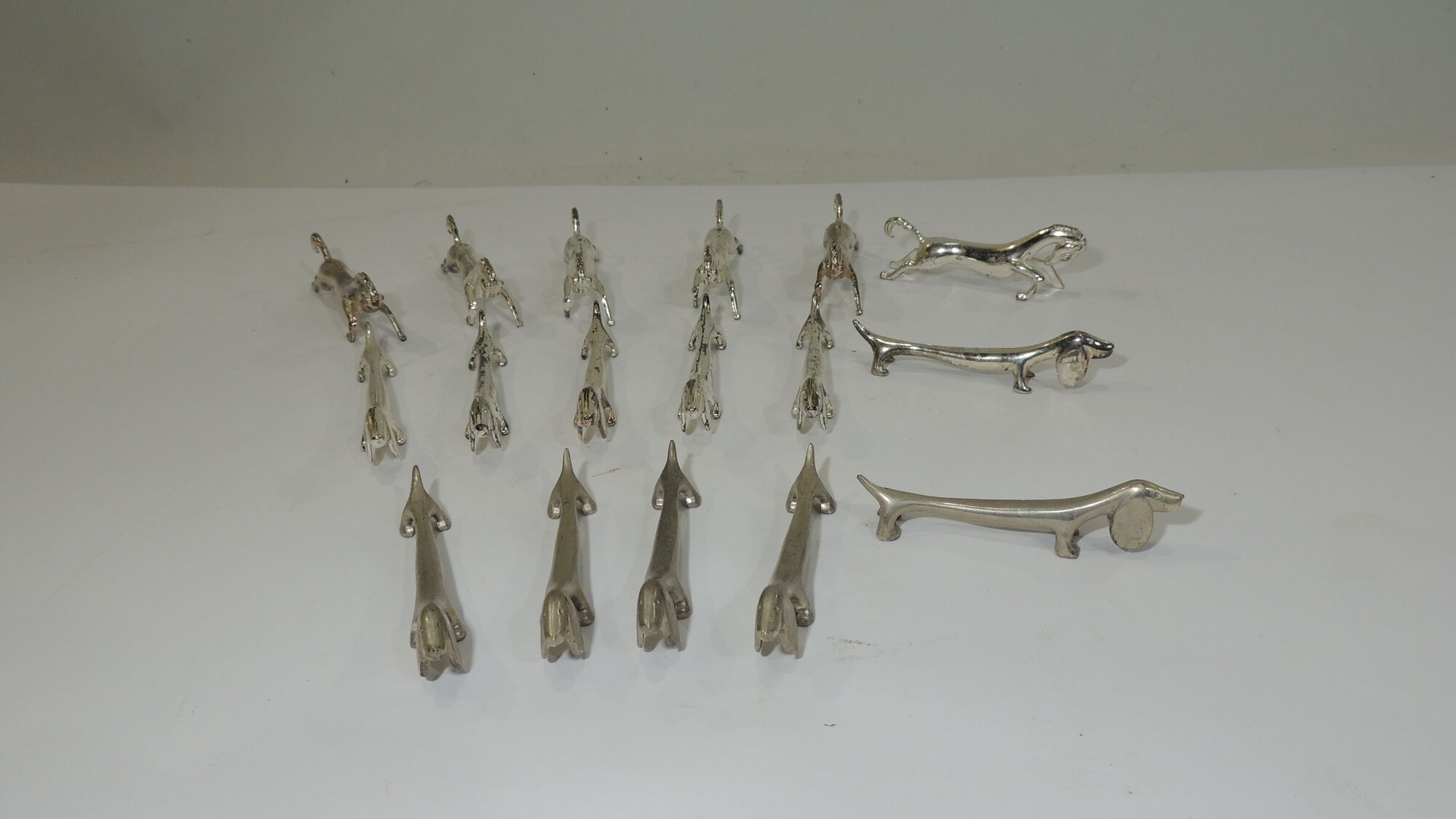 Lot 17 porte couteaux métal /chien /cheveaux/vintage