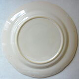 Eastern earthenware plate with floral decoration centered with a rose