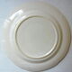 Eastern earthenware plate with floral decoration centered with a rose