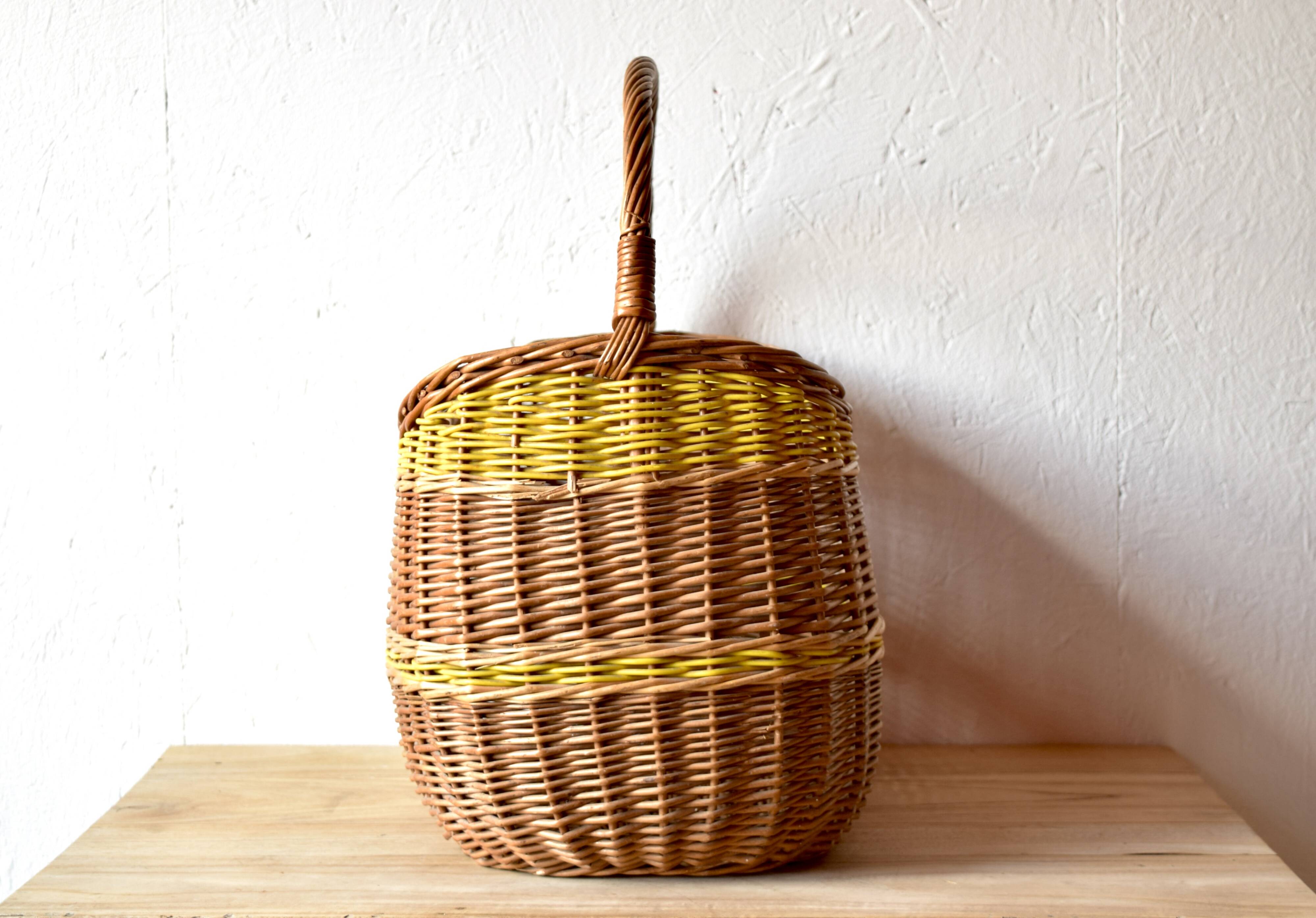Vintage wicker basket crossed with a yellow scoubidou