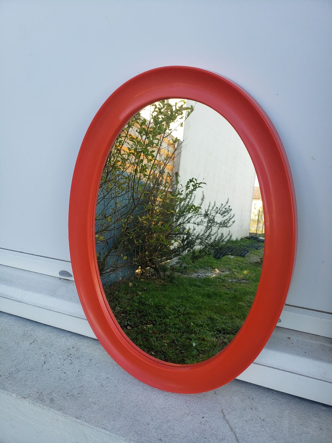 Orange oval mirror 1970 seventie