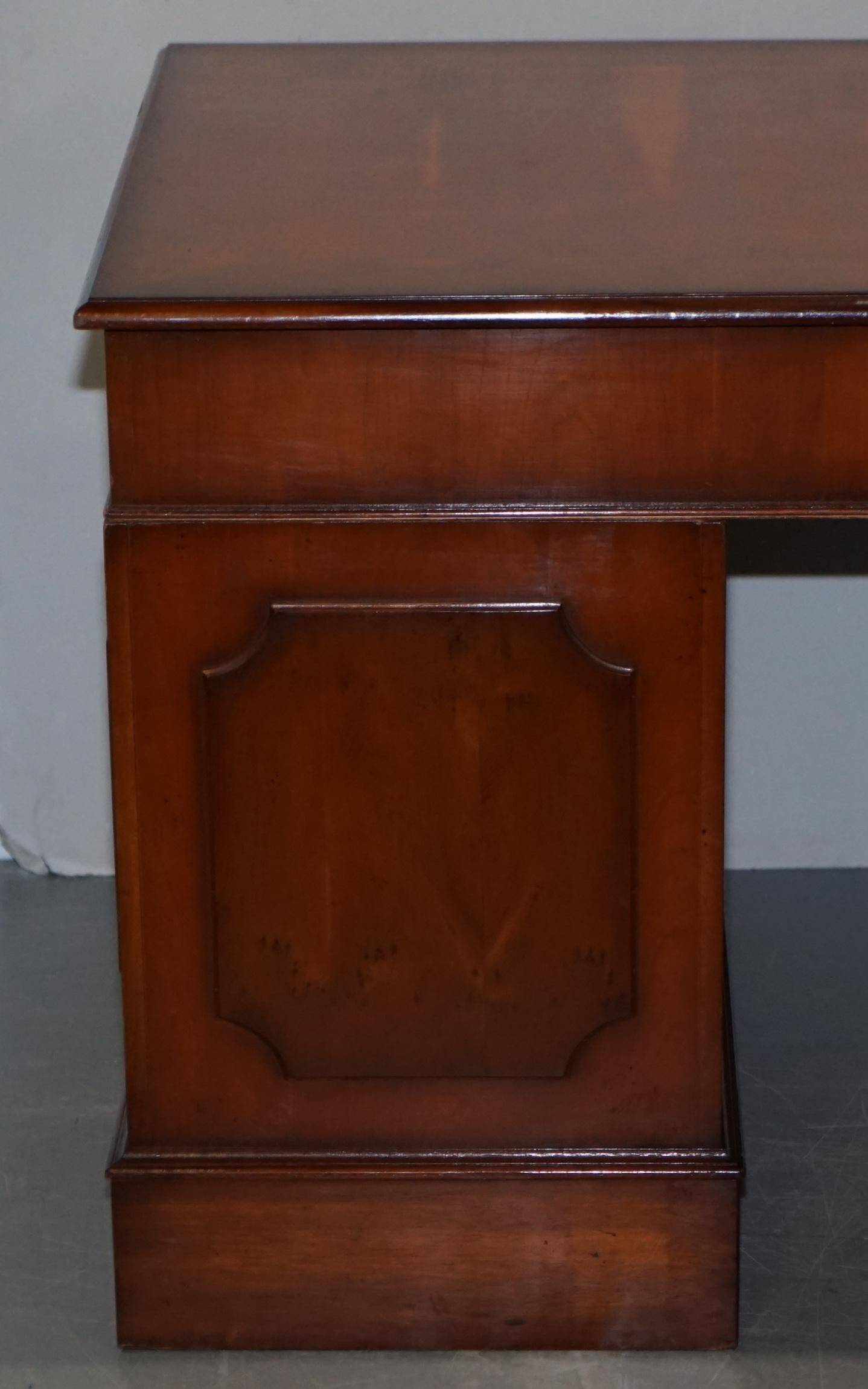 Partner desk with double pedestal in burr yew wood with decorated top.