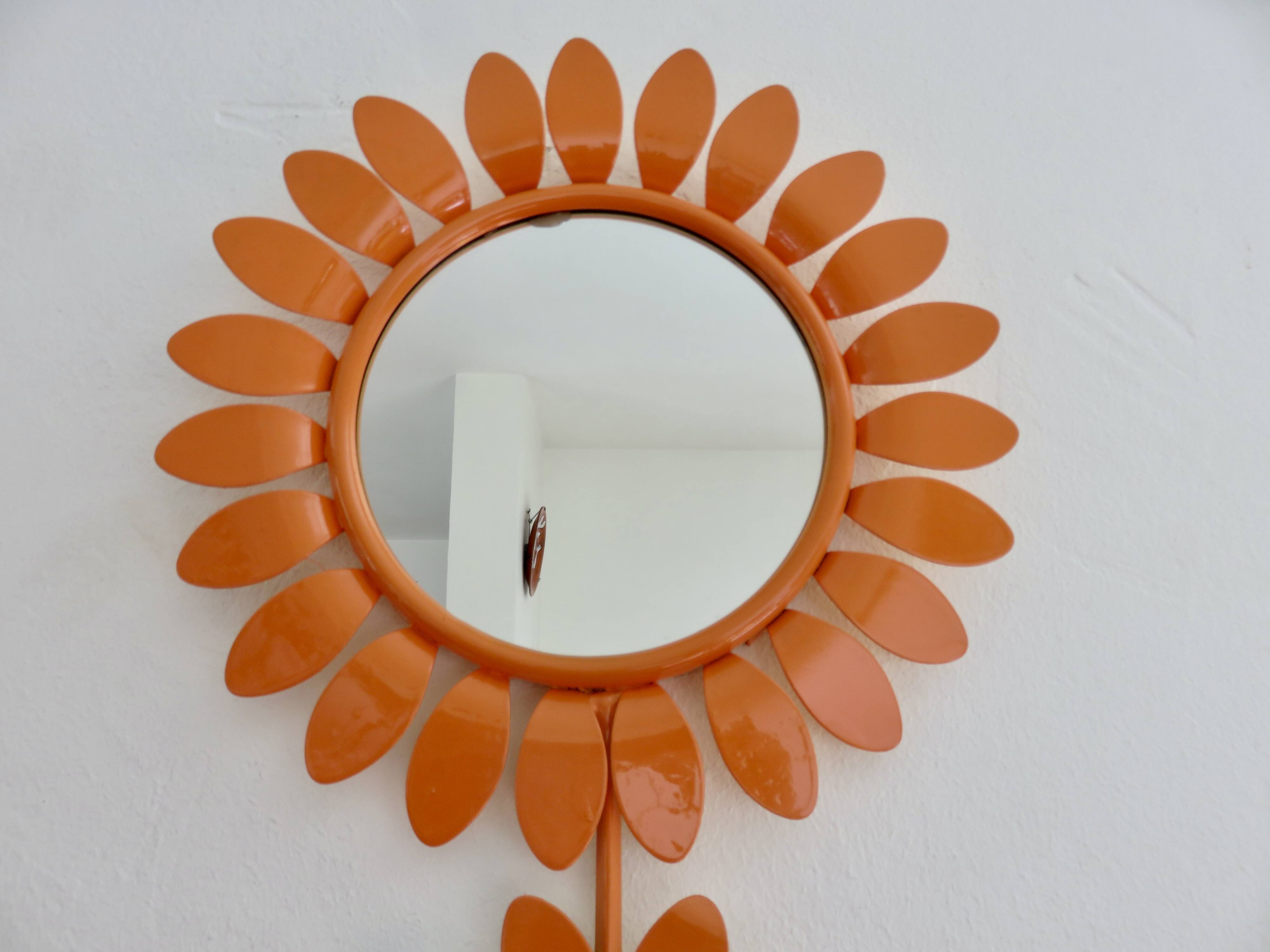 Large 1970s "flower" mirror in orange metal