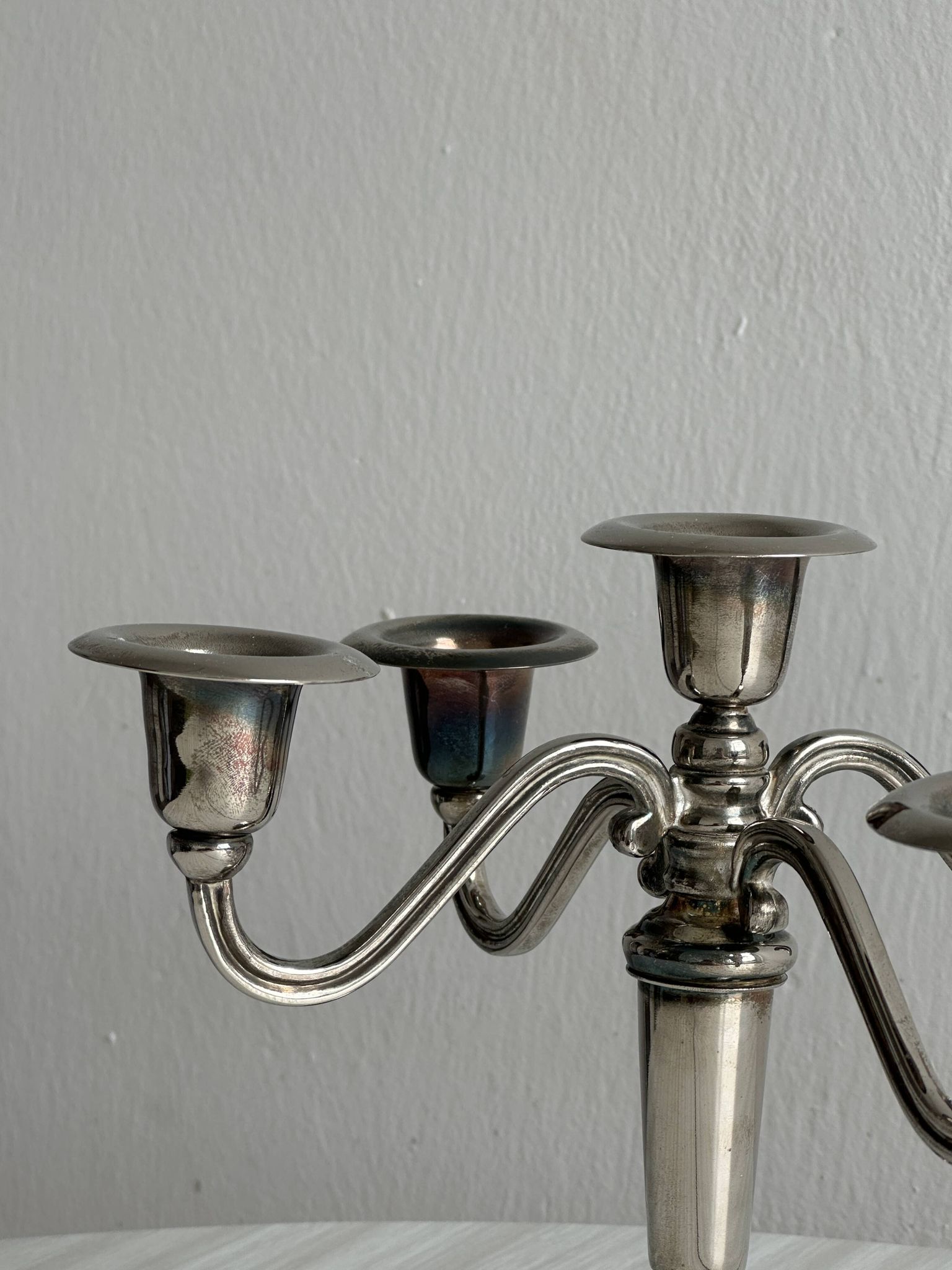 Candlestick candle holder in patinated silver metal