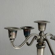 Candlestick candle holder in patinated silver metal
