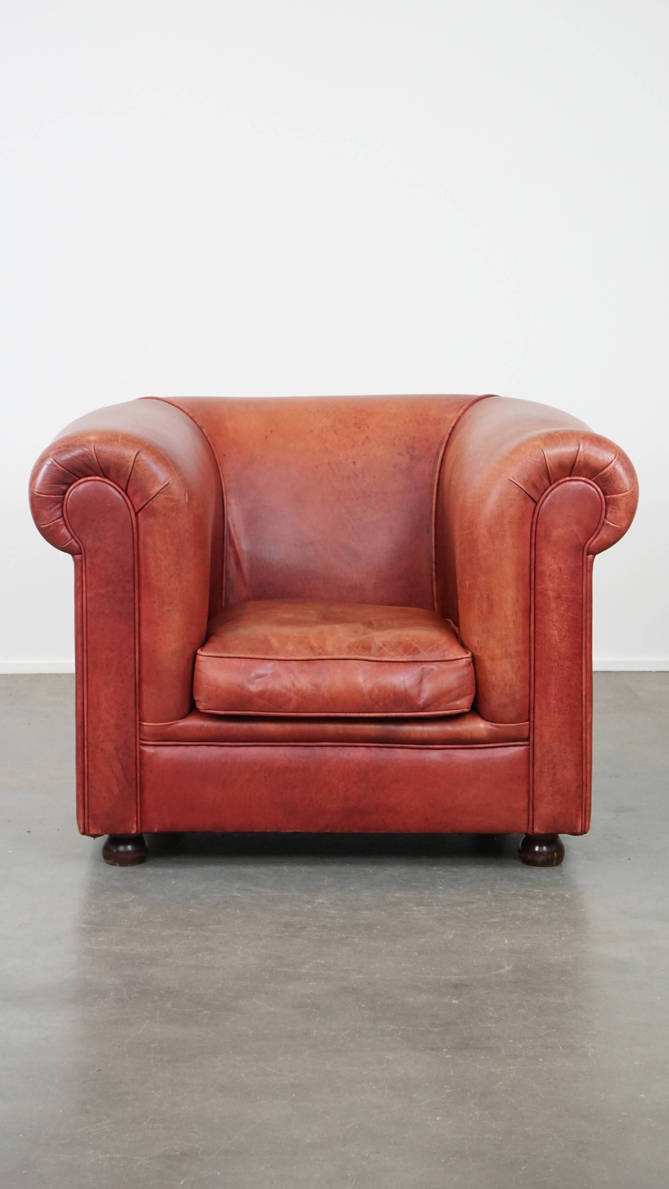 English Chesterfield club chair in light red cowhide leather