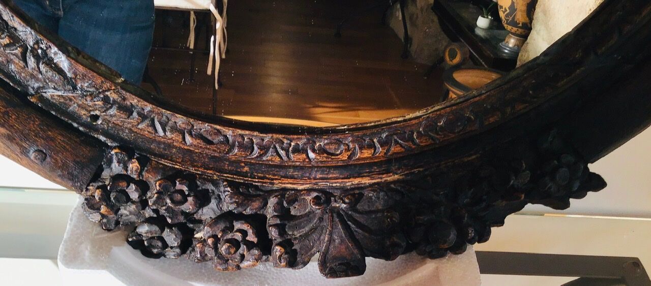 Oval mirror on an 18th century frame