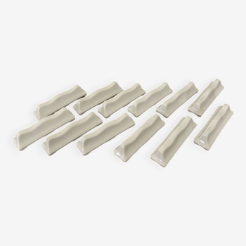 Vintage knife holders of 12, in white wave-shaped porcelain