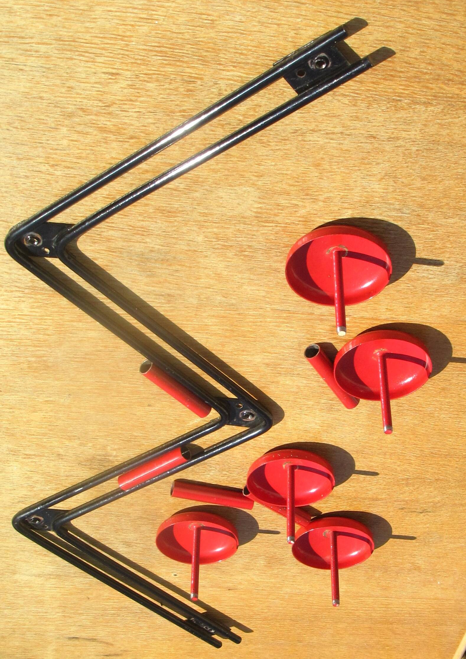 vintage black and red iron coat rack