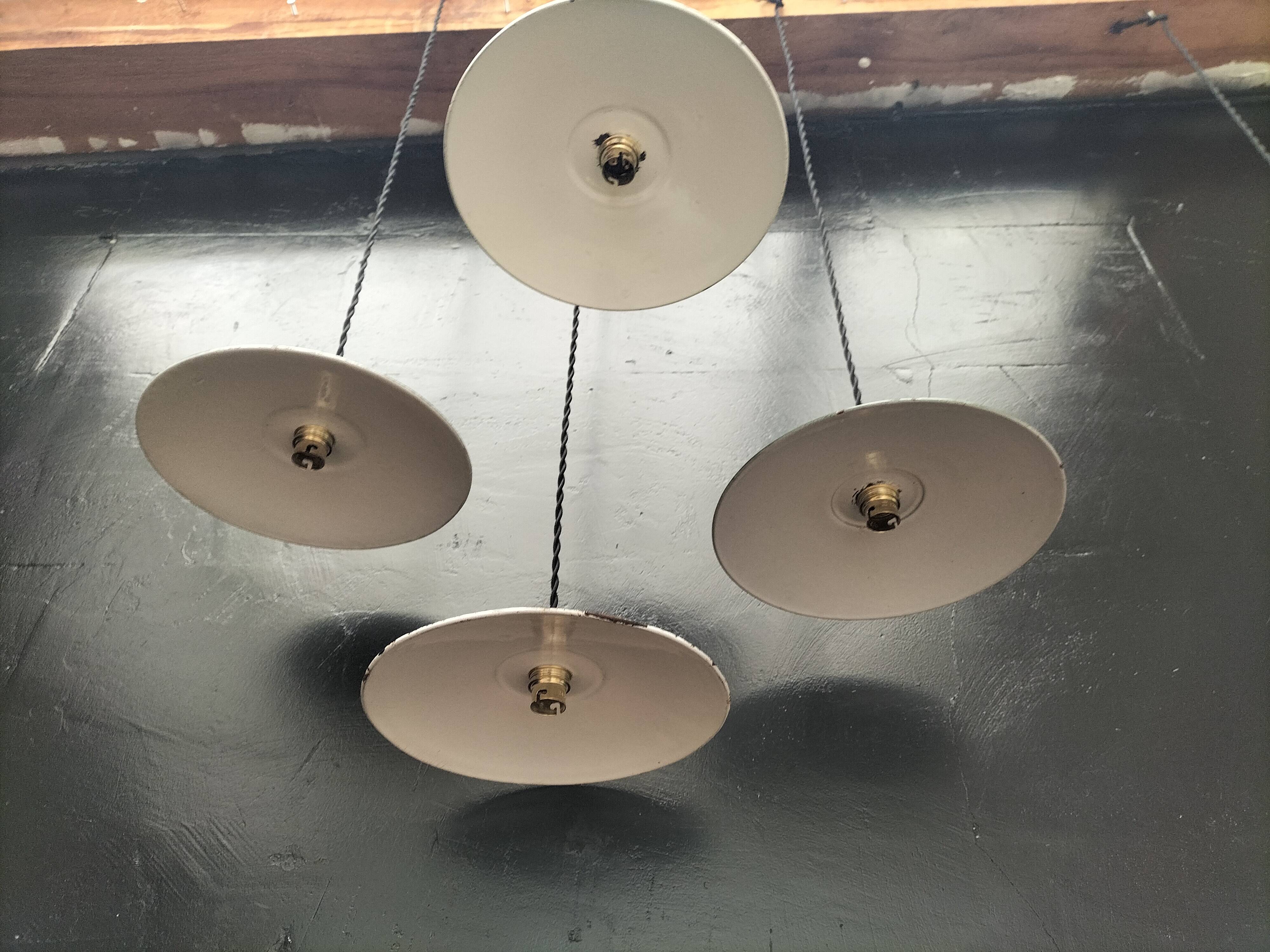 4 enameled sheet metal pendants