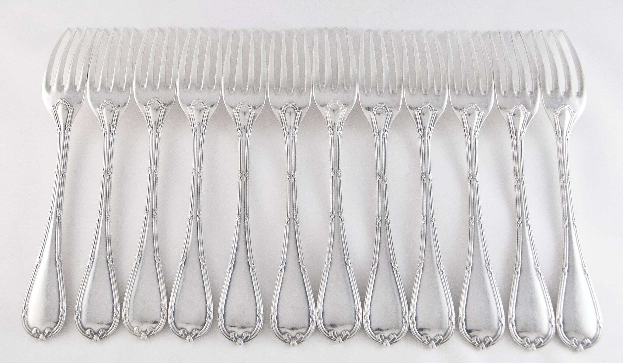 CHRISTOFLE 1907-1935 - 12 table forks and 12 Louis XVI style table spoons, Rubans model