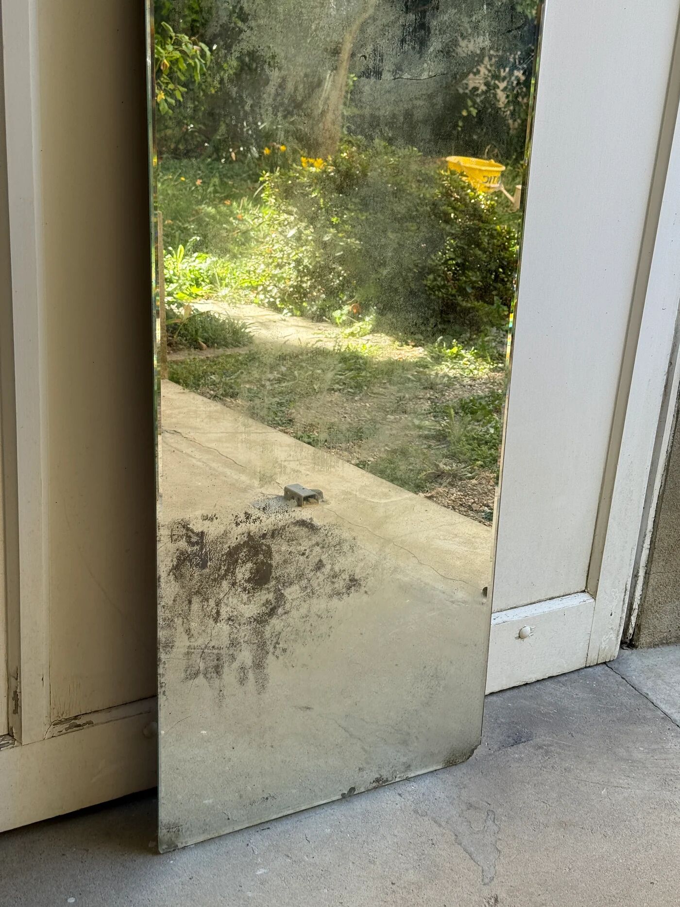 Large vintage mirror with bevelled glass.