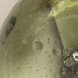 Old demijohn full of bubbles