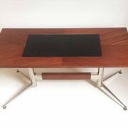 Vintage coffee table from the 1950s in mahogany and metal, with a tabletop width of 110 cm.
