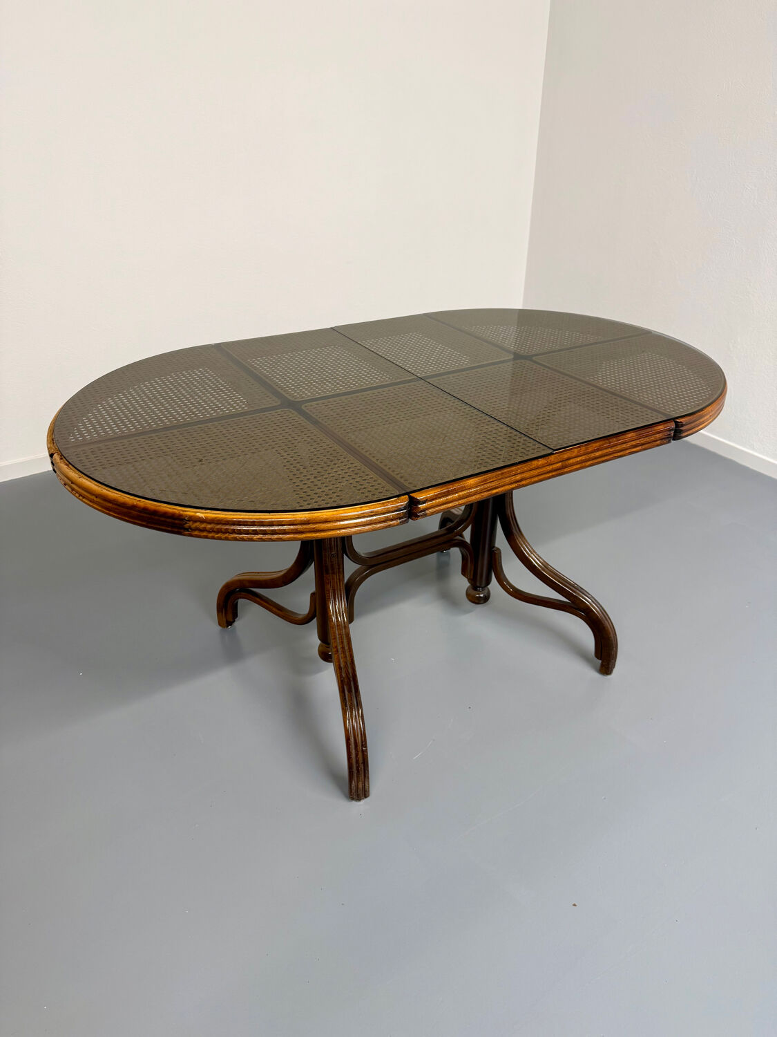 Vintage dining table with a cane top by Mundus from the 1970s.