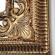 Grand miroir italien doré en bois à verre biseauté