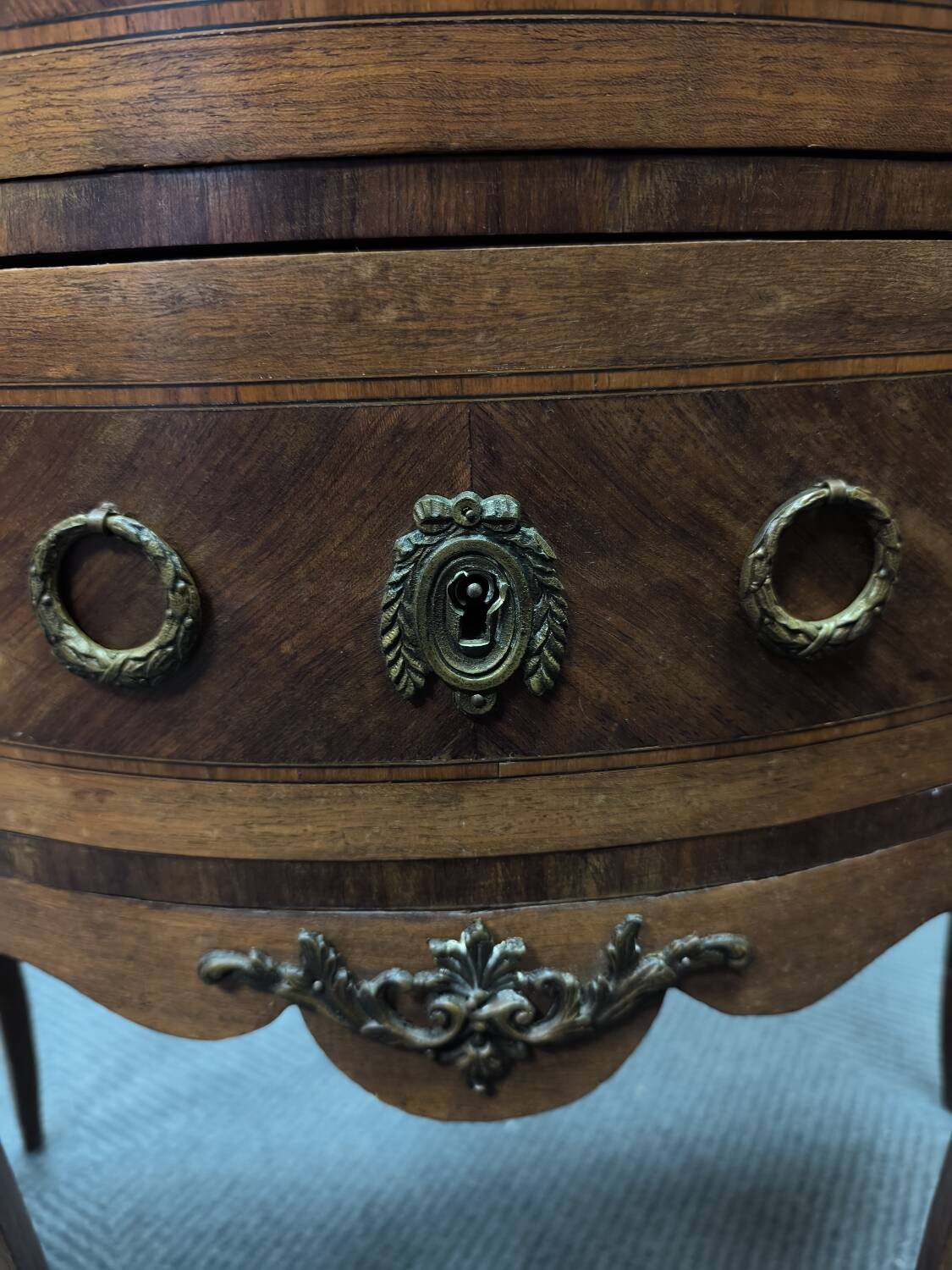 Demi-Lune commode in Louis XVI style with two drawers and veneer.