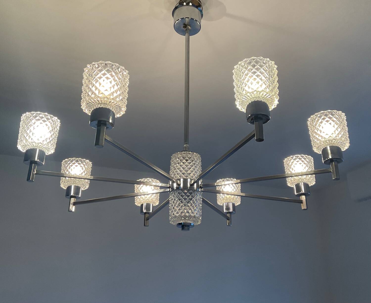 Vintage Italian chandelier from the 60s in chromed metal and glass