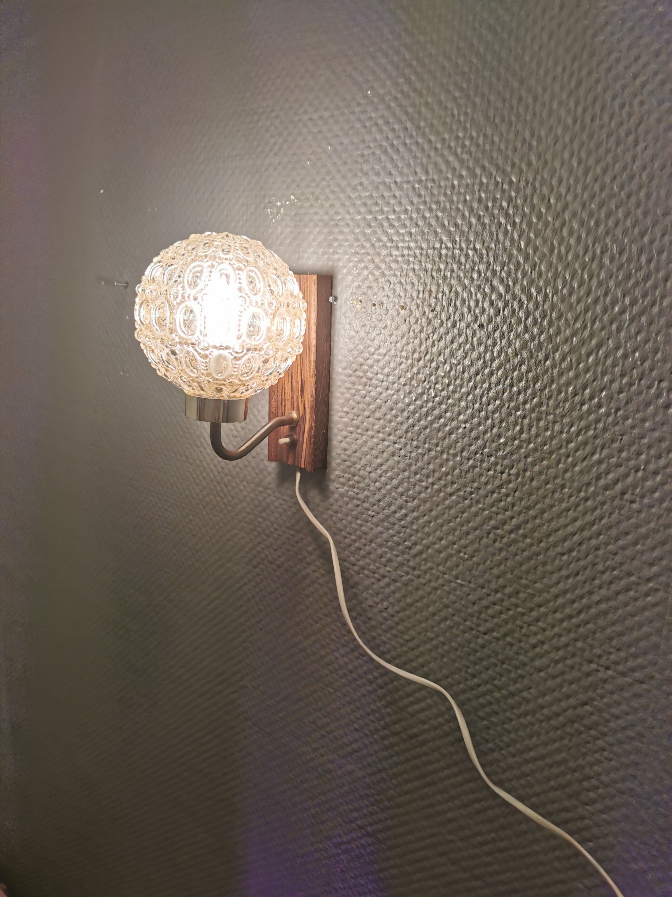 Wall light in rosewood with bobble glass ball shade.
