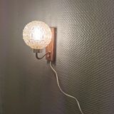 Wall light in rosewood with bobble glass ball shade.