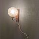 Wall light in rosewood with bobble glass ball shade.