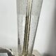 Large globe table lamp with a cracked glass base and brass stand.