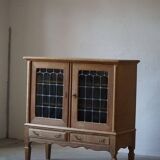 20th-century mid-century solid oak sideboard with glass front, by a Danish cabinetmaker.