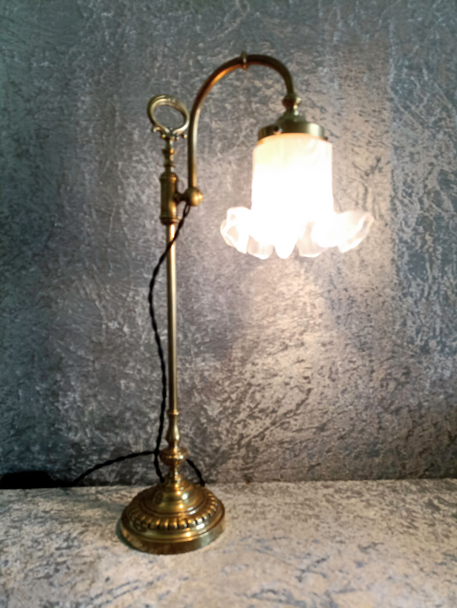 Adjustable brass desk lamp with frosted glass tulip