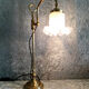 Adjustable brass desk lamp with frosted glass tulip