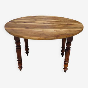 Old round table in solid walnut with flaps