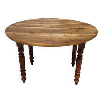 Old round table in solid walnut with flaps