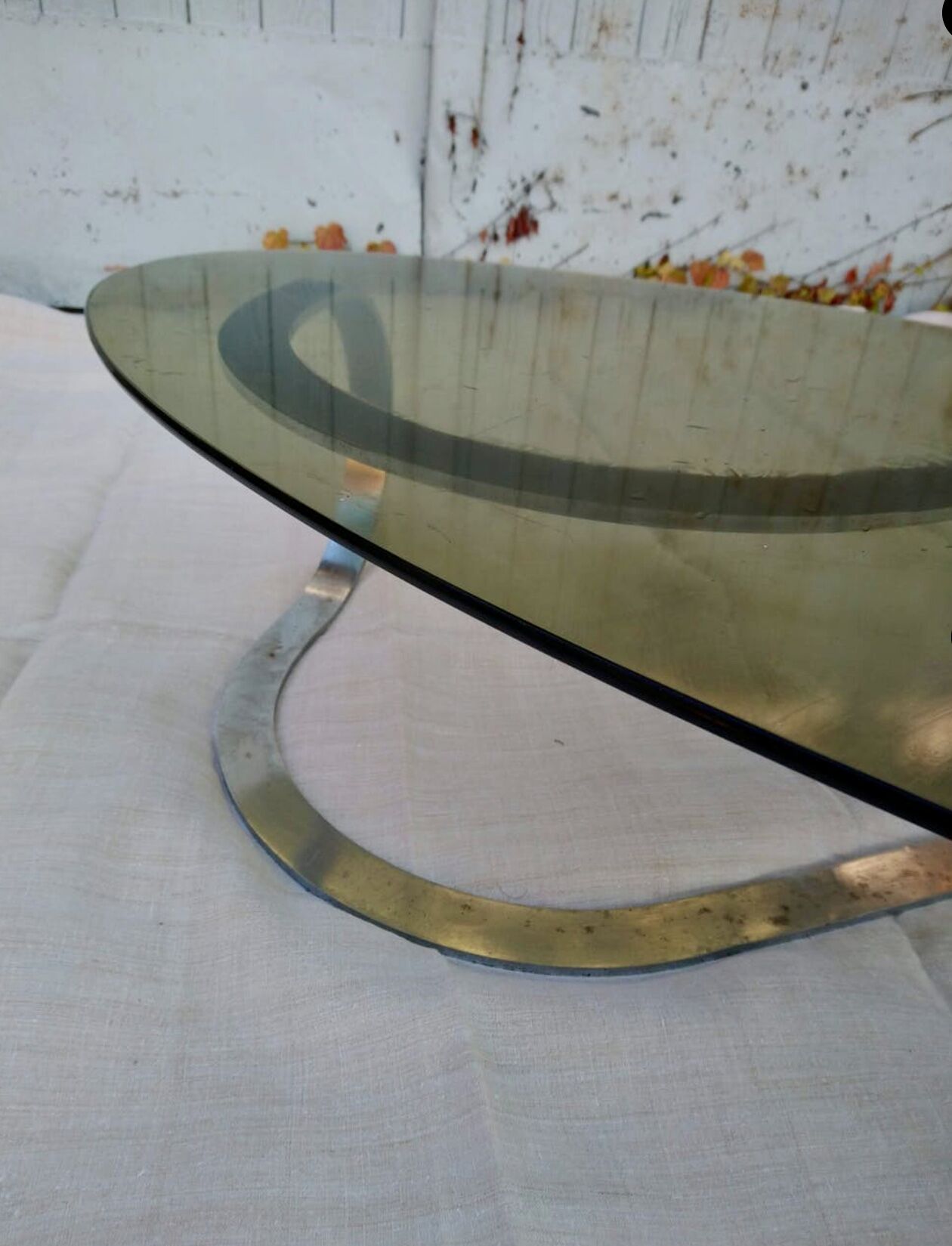 Coffee table oval smoked glass of the 1970s