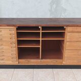 Workshop furniture with drawers and curtain in beech and walnut.
