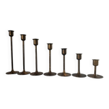 Set of 7 vintage brass candlesticks.