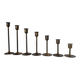 Set of 7 vintage brass candlesticks.