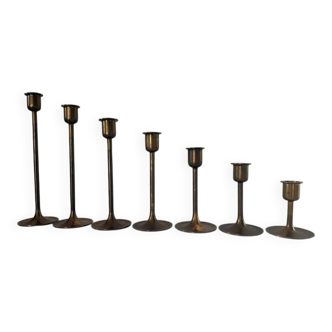 Set of 7 vintage brass candlesticks.