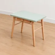 Small vintage children's desk attributed to Baumann – natural wood and lizard green top.